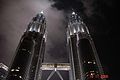 Looking up the front facade of the towers at night.