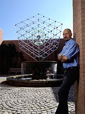 Hans Godo Frabel in front of his "Large Cube with Imploding Glass Spheres" Atlanta Botanical Garden, 2007.