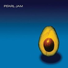 A half-cut avocado stands against a black to blue gradient. The title "Pearl Jam" is written in white letters on the upper left.