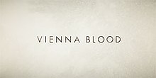 A distressed cream colored background to the logotype "Vienna Blood"