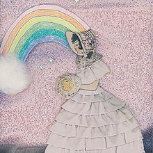 A woman carrying what appear to be flowers, wearing a white dress, in front of a pink background and a rainbow.