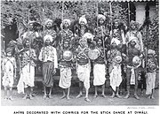 Photograph (1916) of Ahir (now Yadav) dances dressed in cowrie shells for the stick dance at Diwali