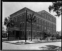 This is a black and white photograph of the Tampa Heights Hospital on the southeast corner of 301 East 7th Avenue, intersecting with Morgan Street : Tampa, Fla.