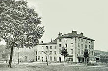 exterior of large house in rural 19th century France