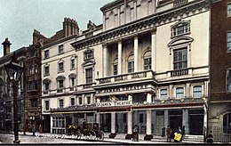 tinted postcard showing exterior of neo-classical building