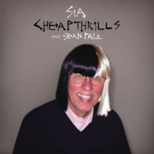 A male figure (the father of Sia's ex husband) wearing a black-white wig while smiling into the camera. The title and names of both the artist and featured artist are portrayed above his head.